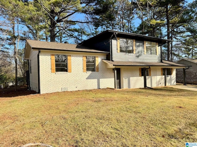 tri-level home featuring a front lawn