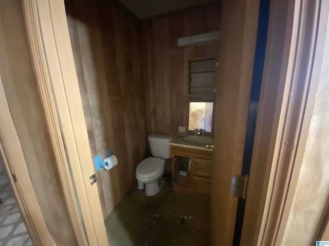 bathroom featuring toilet and vanity