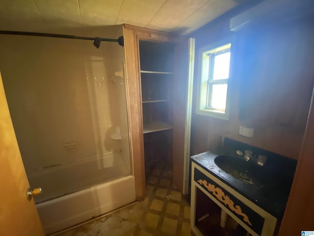 bathroom featuring tile flooring, vanity, and shower / tub combination