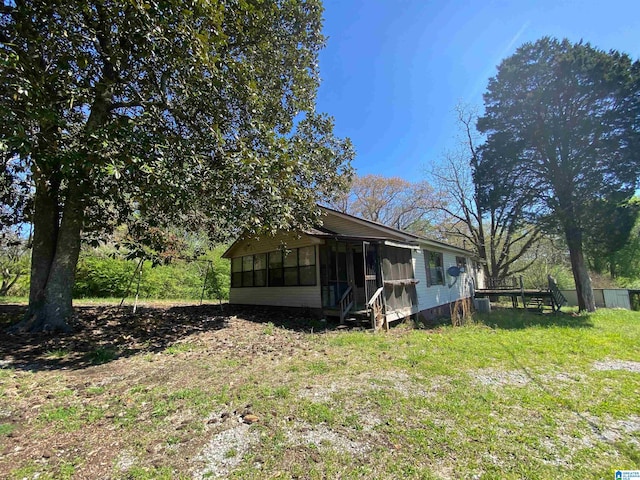 view of yard with a sunroom