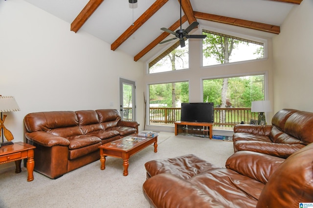 living room with beamed ceiling, high vaulted ceiling, ceiling fan, and carpet