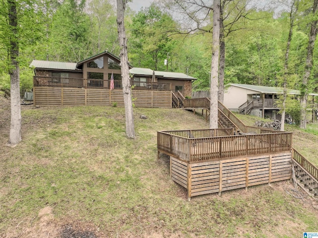 view of yard with a deck and an outdoor structure