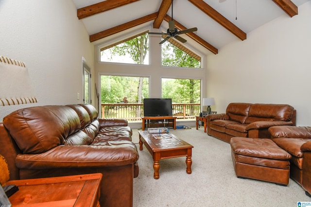 carpeted living room with high vaulted ceiling, beamed ceiling, and ceiling fan