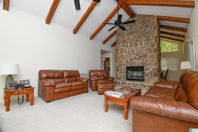 living room with high vaulted ceiling, a stone fireplace, ceiling fan, beam ceiling, and carpet flooring