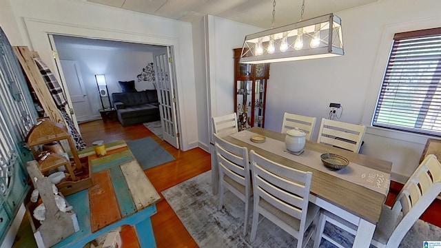 dining space with dark hardwood / wood-style flooring