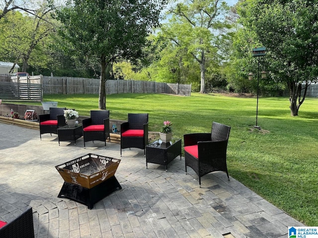 view of terrace with a fire pit