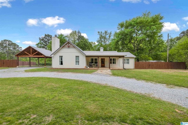 view of front of house with a porch, a front lawn, and a gazebo