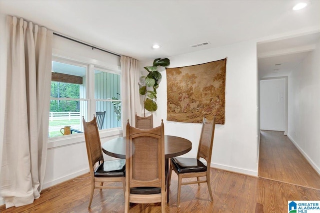 dining area featuring hardwood / wood-style floors