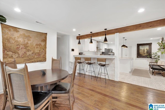 dining space featuring light wood-type flooring