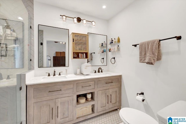 bathroom with tile patterned flooring, vanity, toilet, and a shower with door