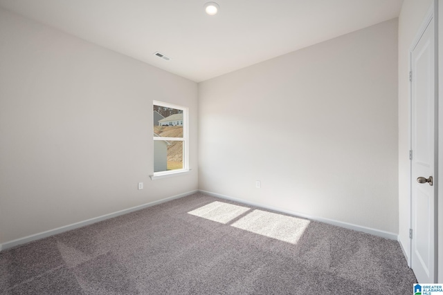 spare room featuring carpet floors