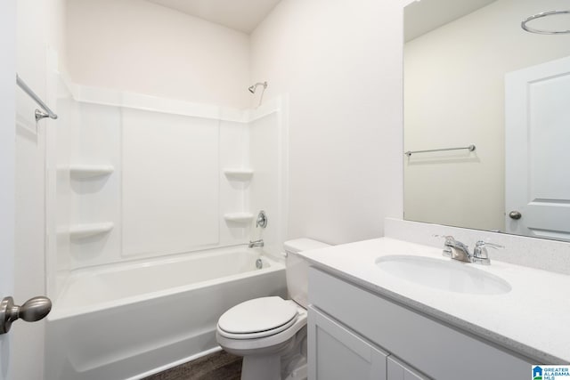 full bathroom featuring tub / shower combination, toilet, and large vanity