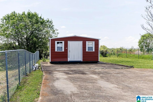 view of shed / structure featuring a lawn