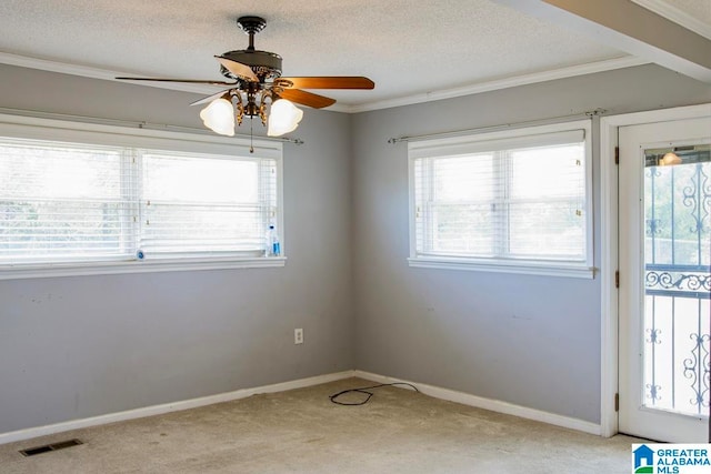 spare room with light colored carpet, a textured ceiling, and ceiling fan