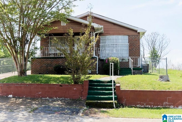 bungalow-style house featuring a front yard