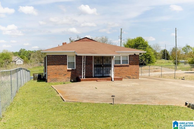 exterior space featuring a patio and a lawn