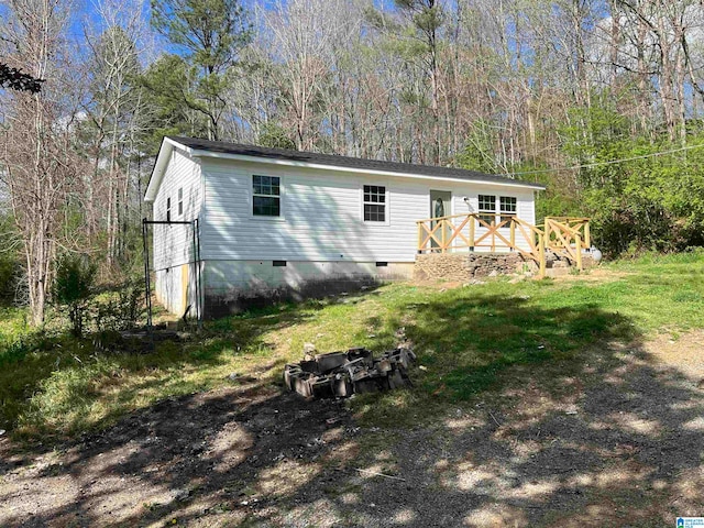 view of property exterior with a deck