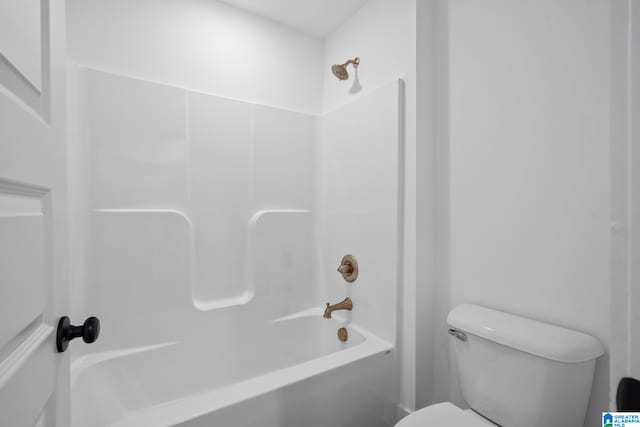 bathroom with shower / tub combination and toilet