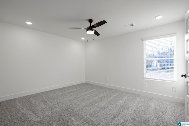 carpeted empty room featuring ceiling fan