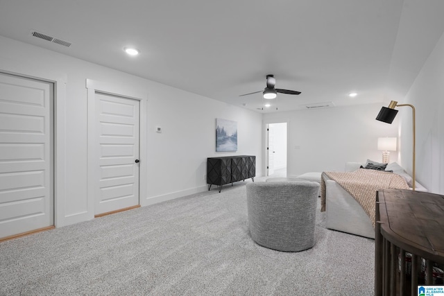 carpeted living room featuring ceiling fan