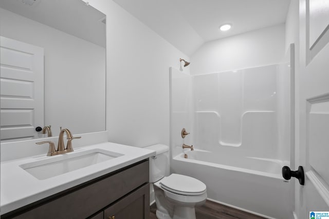 full bathroom featuring wood-type flooring, vanity, toilet, and bathing tub / shower combination