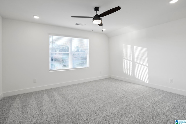 carpeted empty room featuring ceiling fan