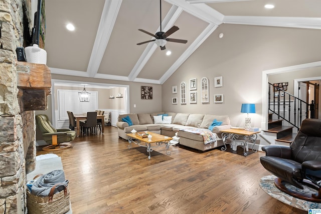 living room featuring high vaulted ceiling, ceiling fan, beamed ceiling, and hardwood / wood-style floors