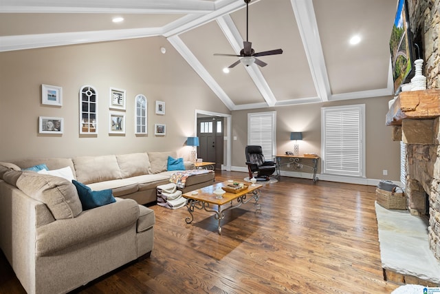 living room featuring high vaulted ceiling, a stone fireplace, ceiling fan, beamed ceiling, and hardwood / wood-style floors