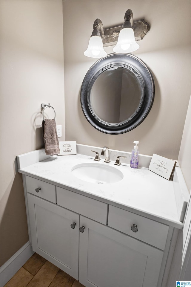 bathroom with tile flooring and vanity