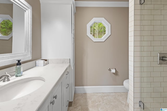 bathroom with toilet, tile flooring, and large vanity