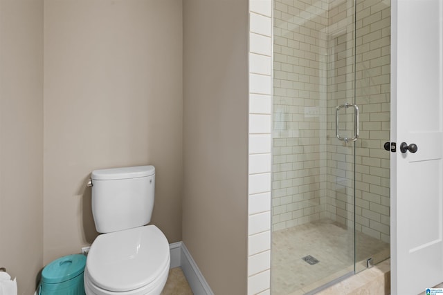 bathroom with walk in shower and toilet