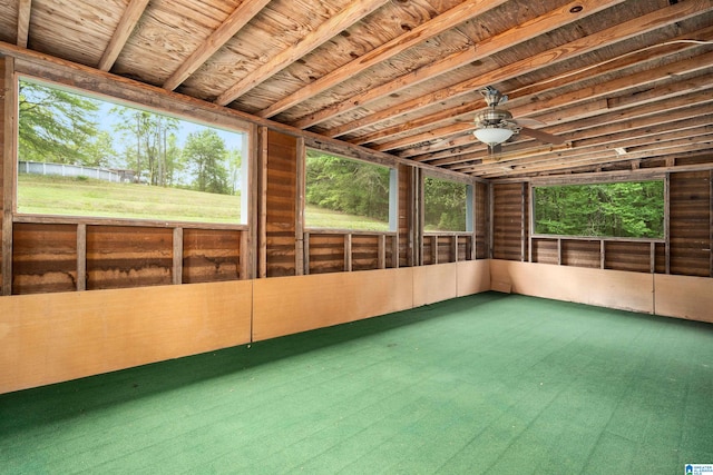 unfurnished sunroom featuring ceiling fan