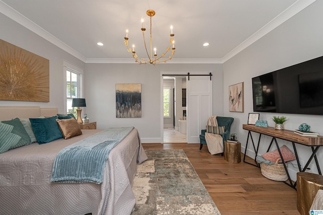 bedroom with a barn door, ornamental molding, a chandelier, and wood-type flooring