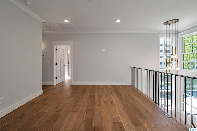 hallway featuring dark hardwood / wood-style flooring and crown molding