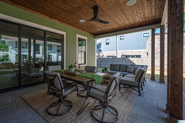 exterior space featuring an outdoor living space and ceiling fan