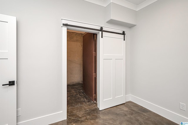 unfurnished bedroom with a barn door