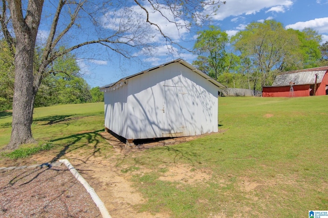 view of shed / structure featuring a lawn