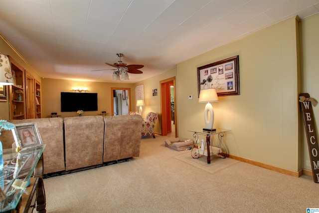 carpeted living room with ceiling fan