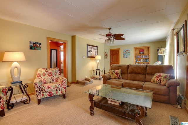 living room with carpet and ceiling fan