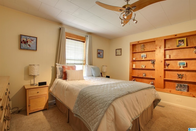 bedroom with light colored carpet and ceiling fan