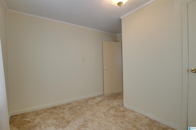 carpeted spare room with ornamental molding