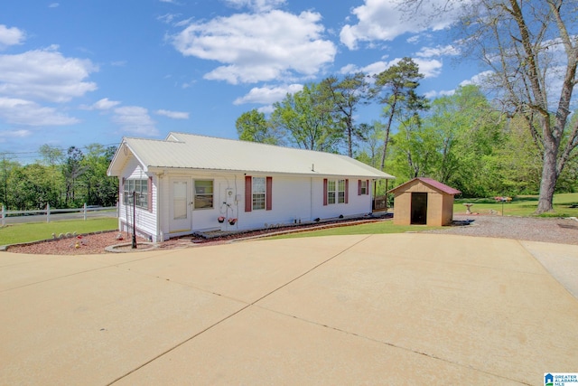 view of front of house featuring a shed