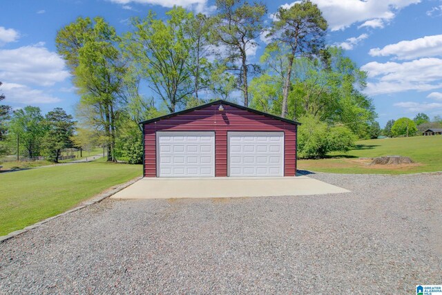 garage with a yard