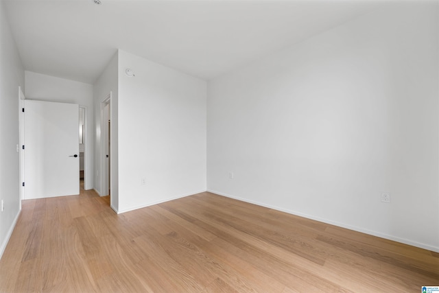 spare room with light hardwood / wood-style flooring