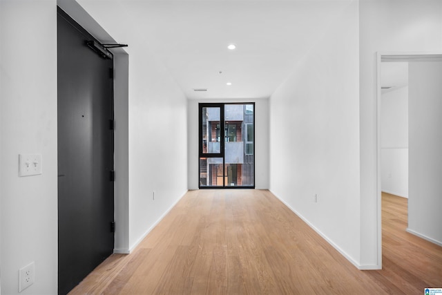 hallway featuring light hardwood / wood-style flooring