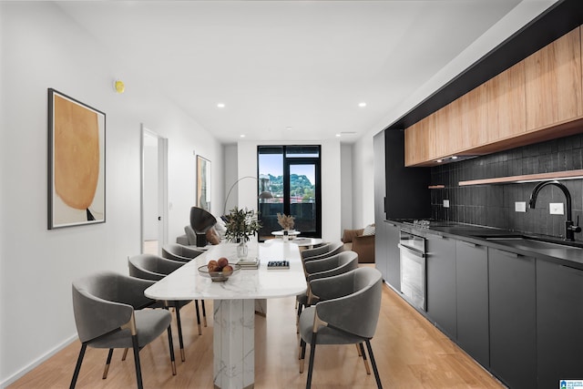 interior space with light hardwood / wood-style floors and sink