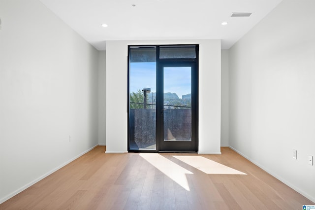 empty room featuring light hardwood / wood-style flooring