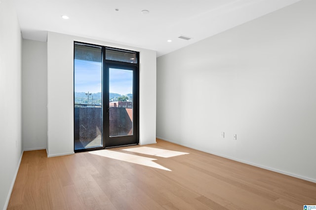 empty room with light wood-type flooring