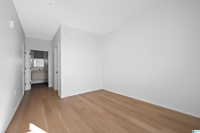 spare room featuring light hardwood / wood-style flooring