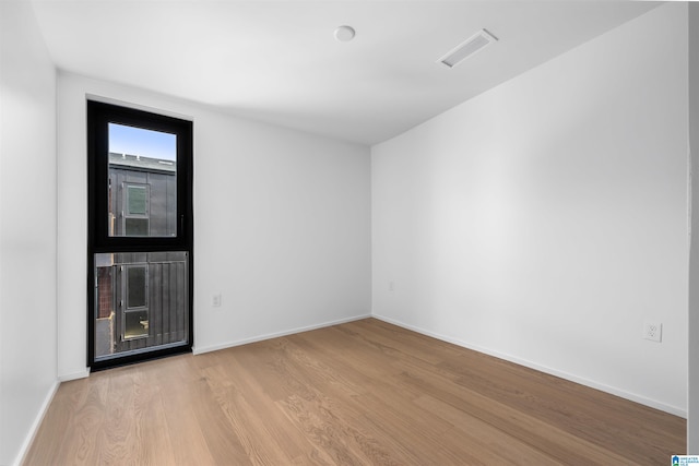 unfurnished room featuring light wood-type flooring